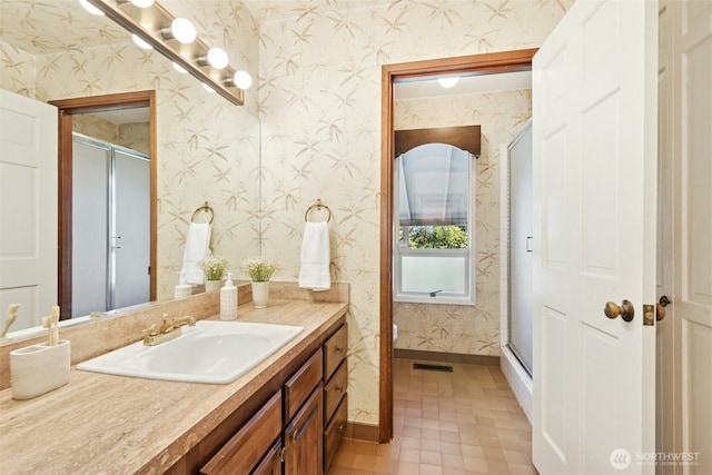 9376 Mercerwood Dr, Mercer Island, WA 98040 - bathroom with a shower stall, wallpapered walls, vanity, baseboards, and visible vents