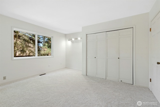 9376 Mercerwood Dr, Mercer Island, WA 98040 - unfurnished bedroom with carpet floors, visible vents, and a closet
