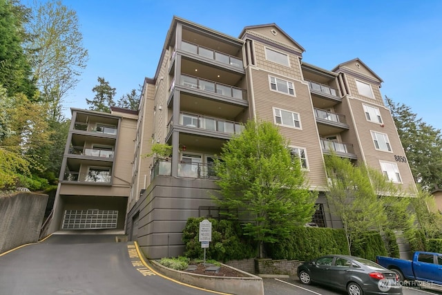 view of property with uncovered parking