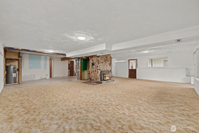 basement with water heater and ornamental molding