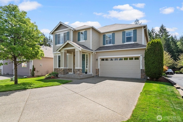 view of front of home featuring driveway, an attached garage, stone siding, and a front yard