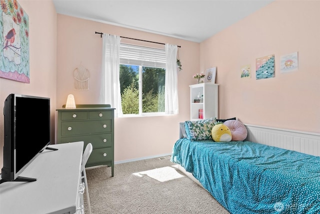 bedroom featuring carpet flooring, radiator, and baseboards