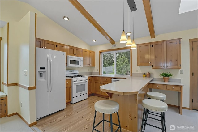 4019 Wexford Loop SE, Olympia, WA 98501 - kitchen featuring white appliances, a peninsula, a kitchen breakfast bar, light wood-style flooring, and light countertops