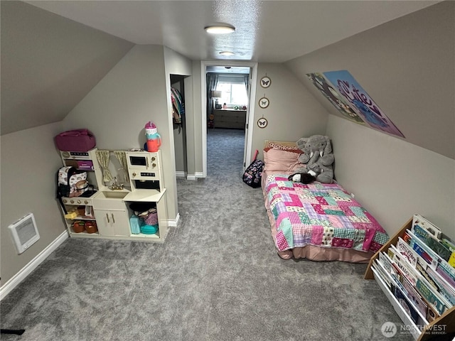 carpeted bedroom with visible vents, baseboards, and lofted ceiling
