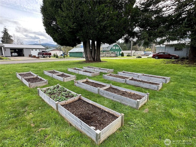 surrounding community with a garden and a yard
