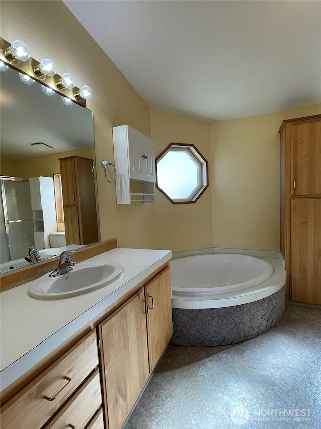 700 Pearl Hill Rd, Bridgeport, WA 98813 - full bath featuring a shower stall, vanity, and a garden tub