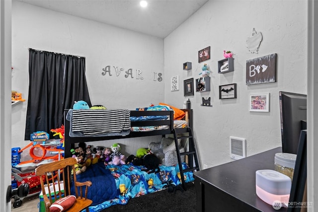 411W 1st Ave, Kennewick, WA 99336 - bedroom with visible vents and a textured wall
