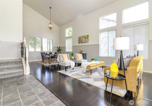 19204 Evergreen Dr, Bonney Lake, WA 98391 - living area with high vaulted ceiling, baseboards, and wood finished floors