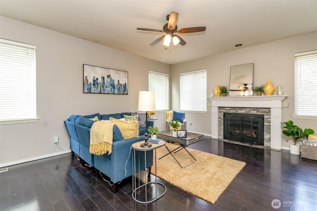 19204 Evergreen Dr, Bonney Lake, WA 98391 - living area with wood finished floors, a fireplace, a ceiling fan, and baseboards