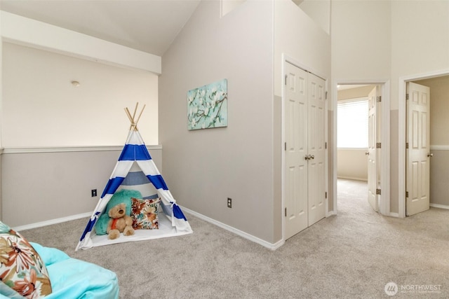 19204 Evergreen Dr, Bonney Lake, WA 98391 - playroom featuring carpet floors, baseboards, and high vaulted ceiling