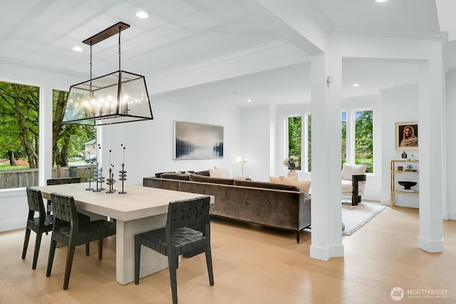 dining space featuring light wood-style floors, crown molding, baseboards, and recessed lighting