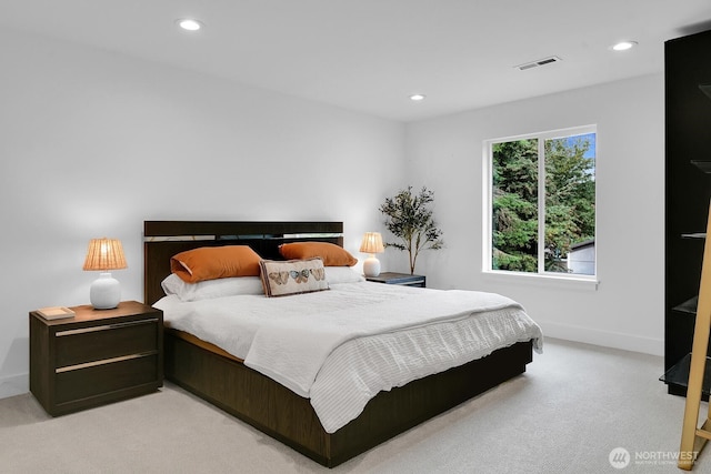 bedroom featuring visible vents, baseboards, recessed lighting, and light colored carpet