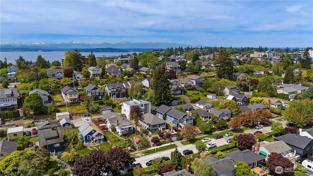 aerial perspective of suburban area with a water and mountain view