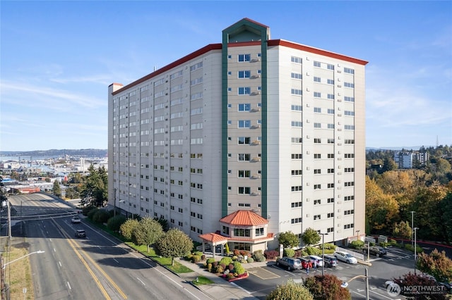 view of property featuring uncovered parking