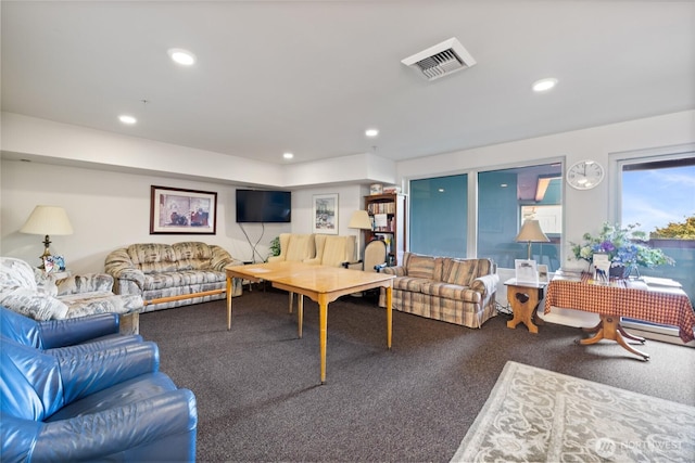 carpeted living room with visible vents and recessed lighting
