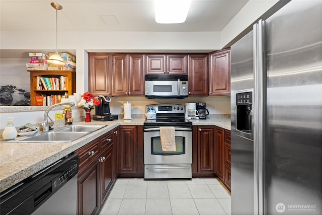 kitchen featuring light countertops, a sink, and stainless steel appliances
