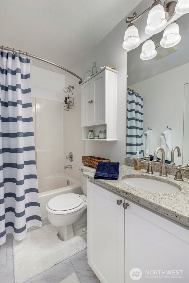 full bathroom with marble look tile flooring, toilet, vanity, and shower / bathtub combination with curtain