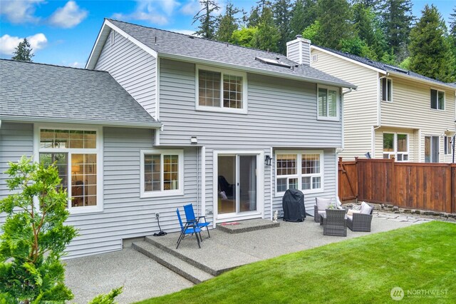 back of house with a patio area, a chimney, an outdoor hangout area, and roof with shingles