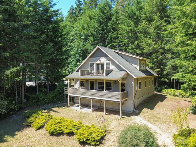 325 Evergreen View Pkwy, Port Angeles, WA 98363 - back of property featuring crawl space, roof with shingles, a forest view, and a balcony