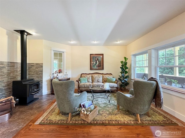 325 Evergreen View Pkwy, Port Angeles, WA 98363 - living area featuring a wood stove and baseboards