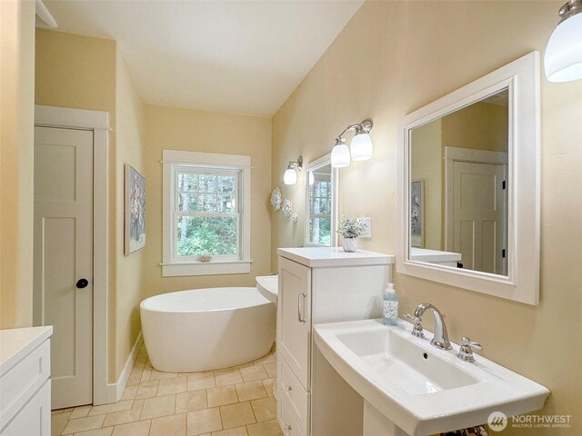 325 Evergreen View Pkwy, Port Angeles, WA 98363 - full bathroom featuring a freestanding bath, tile patterned floors, and a sink