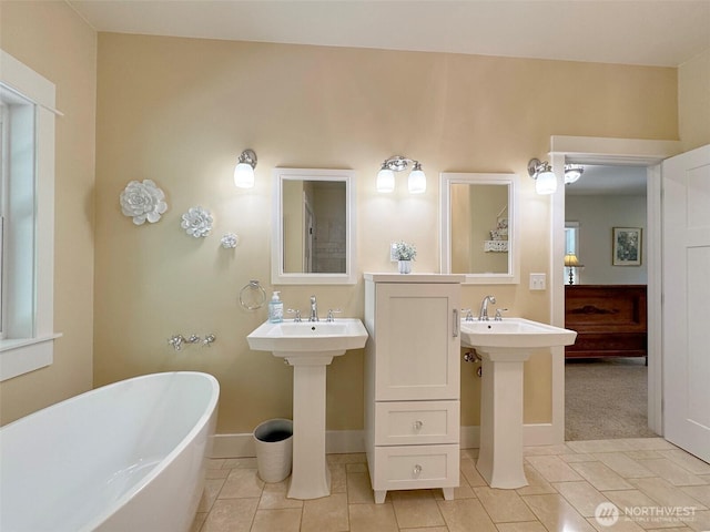 325 Evergreen View Pkwy, Port Angeles, WA 98363 - full bathroom with a freestanding tub, baseboards, and tile patterned flooring