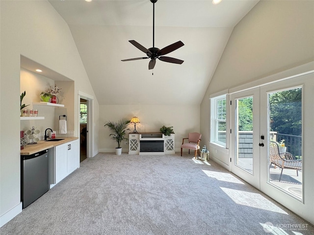 325 Evergreen View Pkwy, Port Angeles, WA 98363 - living room featuring light carpet, french doors, baseboards, and plenty of natural light