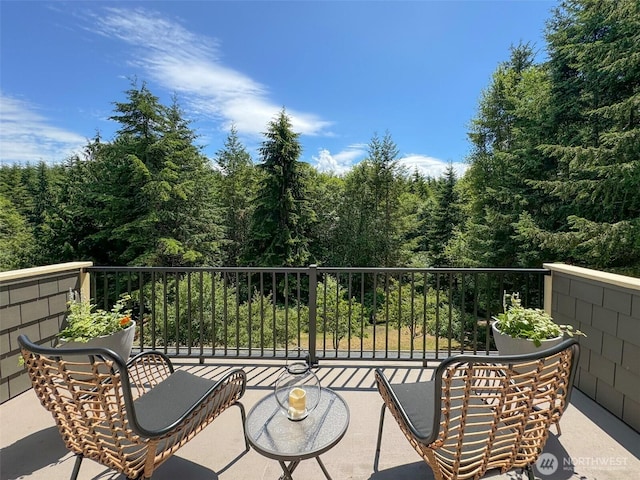 325 Evergreen View Pkwy, Port Angeles, WA 98363 - balcony featuring a wooded view