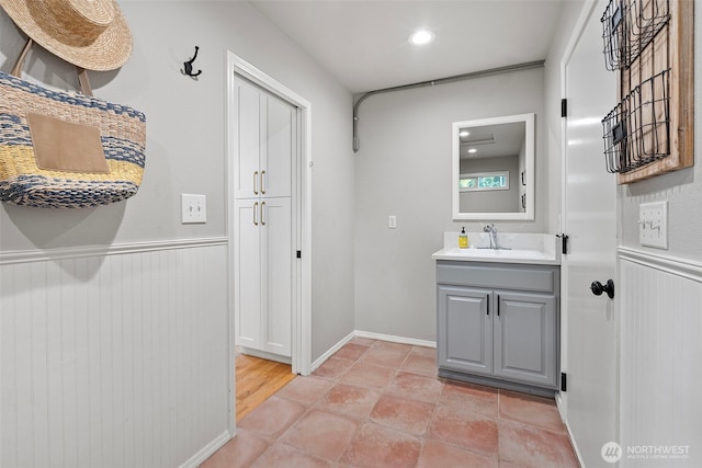 1716 7th St SE, Puyallup, WA 98372 - bathroom with vanity and wainscoting