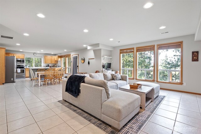 1716 7th St SE, Puyallup, WA 98372 - living room with recessed lighting, light tile patterned floors, and visible vents