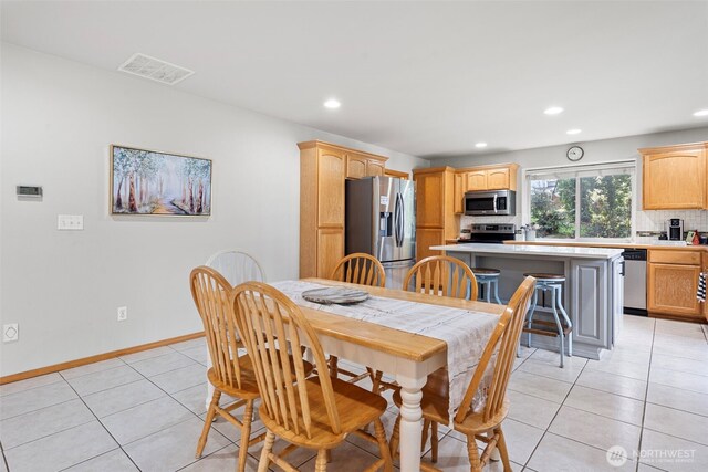 1716 7th St SE, Puyallup, WA 98372 - dining area featuring visible vents, baseboards, recessed lighting, and light tile patterned flooring