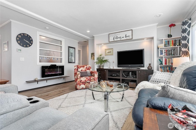 living area featuring crown molding, recessed lighting, and wood finished floors