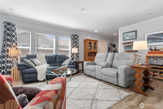 living area with ornamental molding, recessed lighting, and wood finished floors