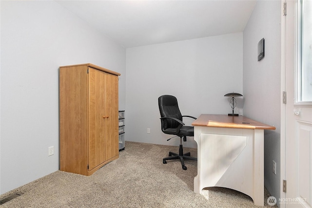 carpeted home office with visible vents