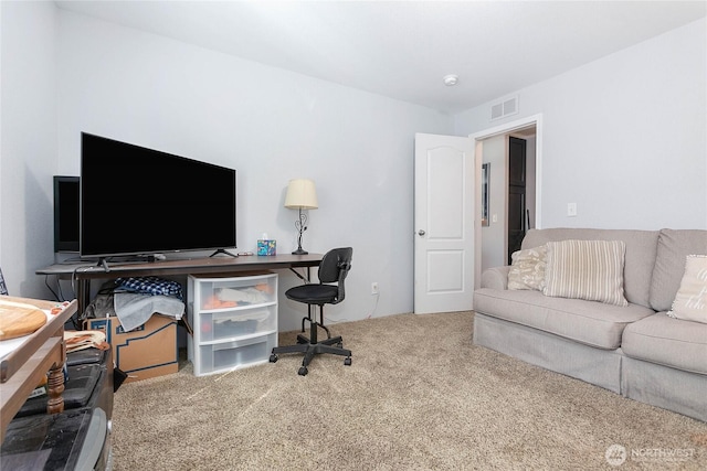 office area with carpet flooring and visible vents