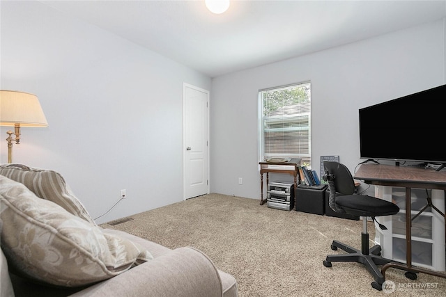 office area featuring carpet flooring and visible vents