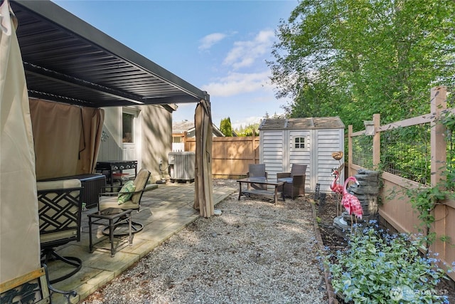 view of yard with a storage shed, a fenced backyard, central AC unit, a patio area, and an outdoor structure