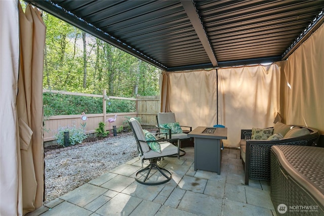 view of patio with fence and outdoor lounge area