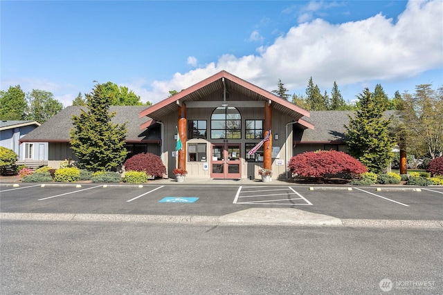 view of building exterior with uncovered parking