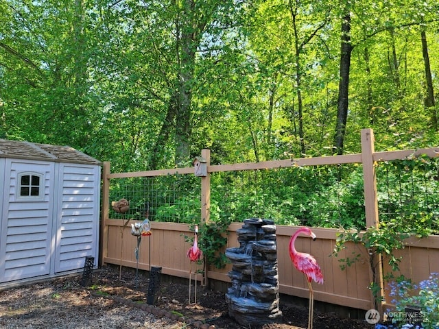 view of shed with fence