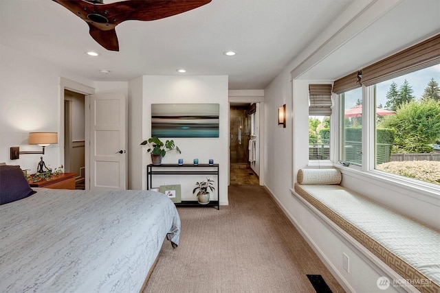 bedroom featuring visible vents, baseboards, recessed lighting, and light carpet