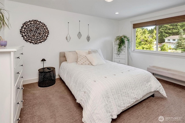 carpeted bedroom featuring recessed lighting and baseboards