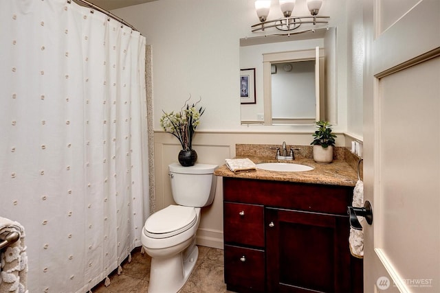 full bath with a shower with curtain, toilet, a chandelier, vanity, and tile patterned floors
