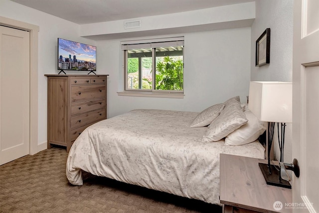 bedroom with visible vents and carpet floors