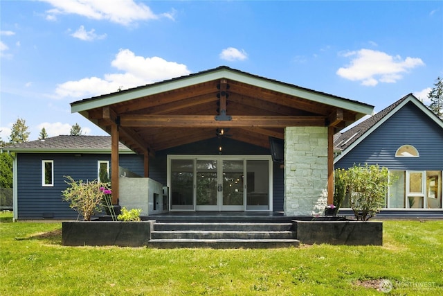 12425 318th Ave NE, Duvall, WA 98019 - rear view of property with a yard, french doors, and stone siding