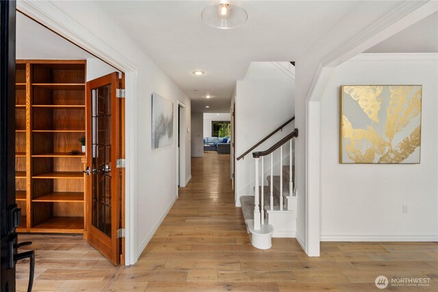 12425 318th Ave NE, Duvall, WA 98019 - hall with light wood-type flooring, stairway, baseboards, french doors, and recessed lighting