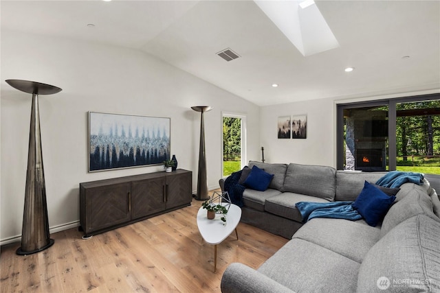 12425 318th Ave NE, Duvall, WA 98019 - living room featuring lofted ceiling, a skylight, light wood-type flooring, and recessed lighting