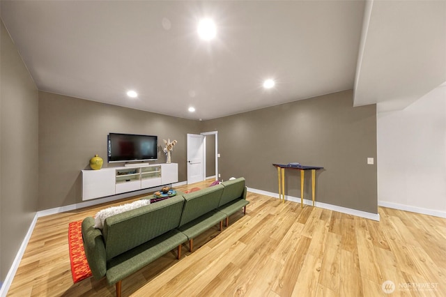 living room with baseboards, recessed lighting, and wood finished floors