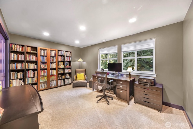 office area featuring recessed lighting, baseboards, carpet flooring, visible vents, and bookshelves