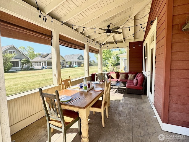 sunroom with an outdoor living space, a wealth of natural light, and a ceiling fan